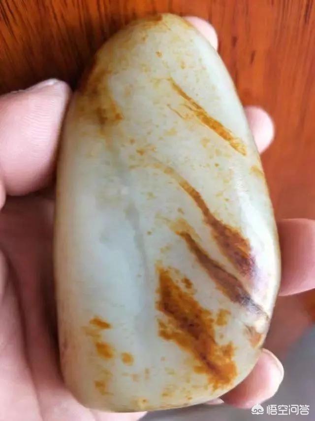 和田玉假皮的特征图片,和田玉不是籽料，但有皮色，是假的吗？