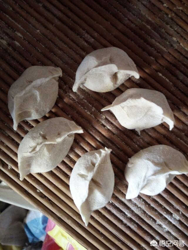 悟空问答 - 下图中饺子吃出了硬币,是北方什么习俗?(画卷的回答,0赞)